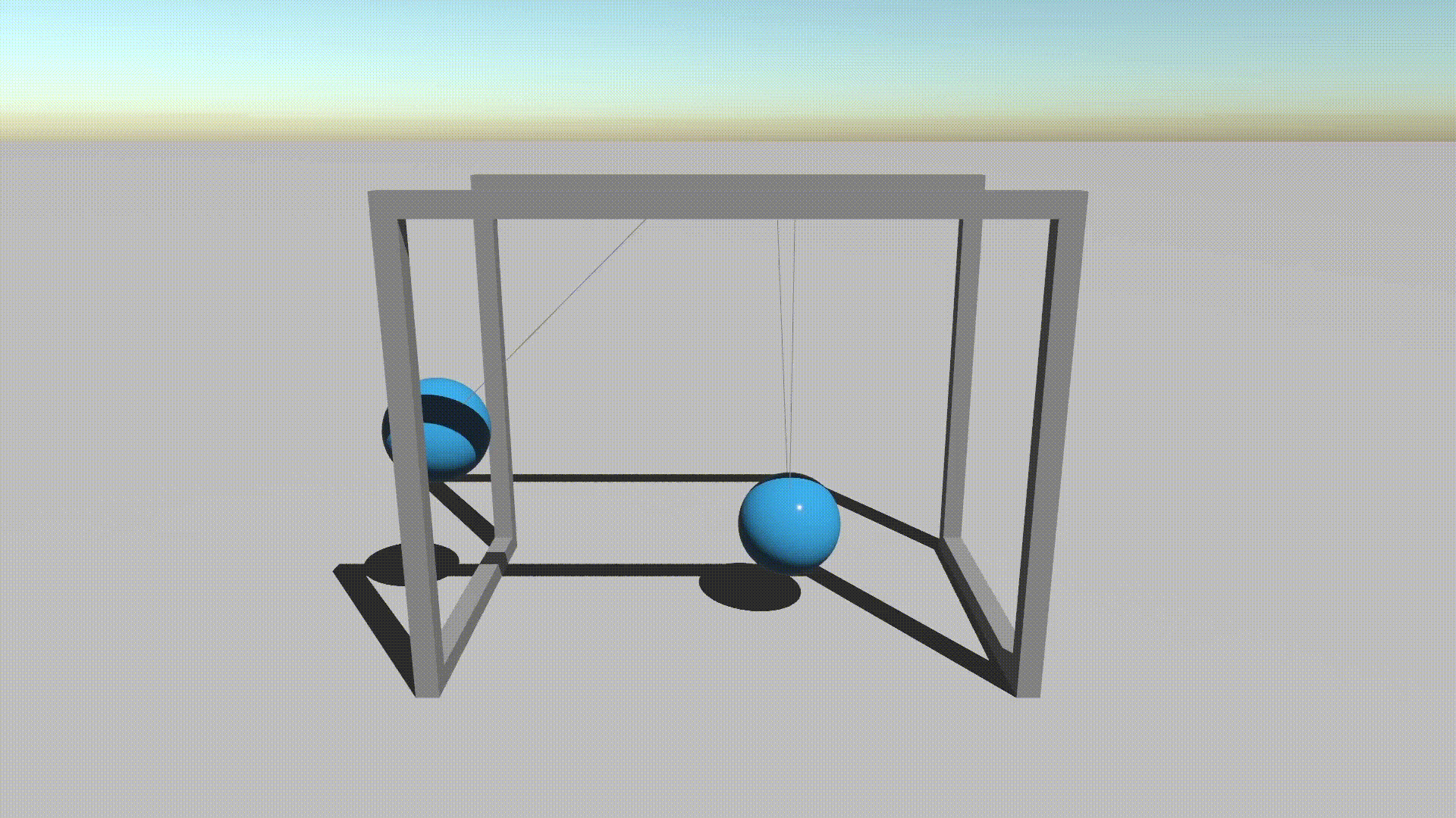 Balls held by string swinging and hitting each other in a Newton's cradle